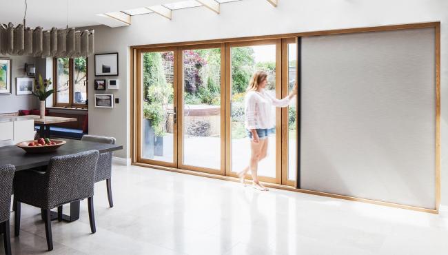 Centor 205 bifold patio door with retractable blind built into the door frame